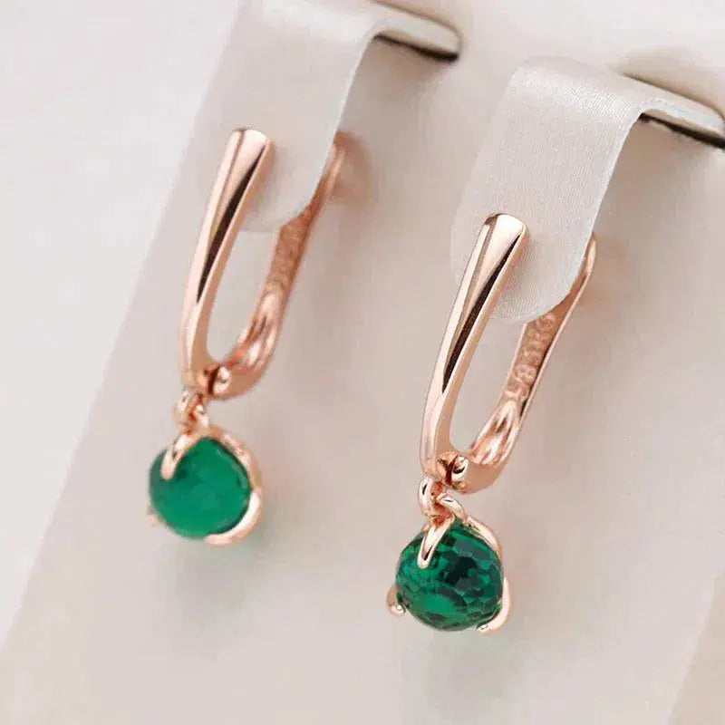 Elegant earrings with green crystals in gold