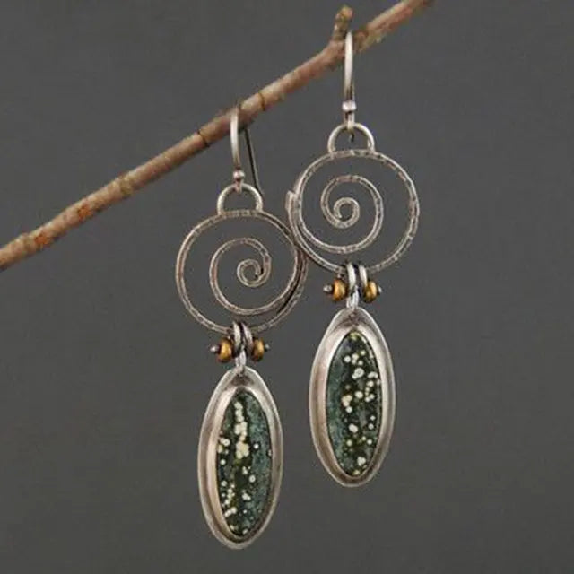 Vintage earrings with light green stone in silver