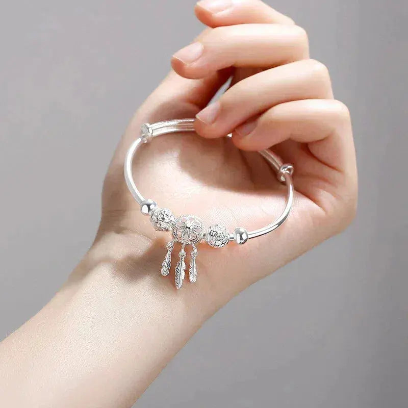 Adjustable bracelet with triple leaf charms made of sterling silver